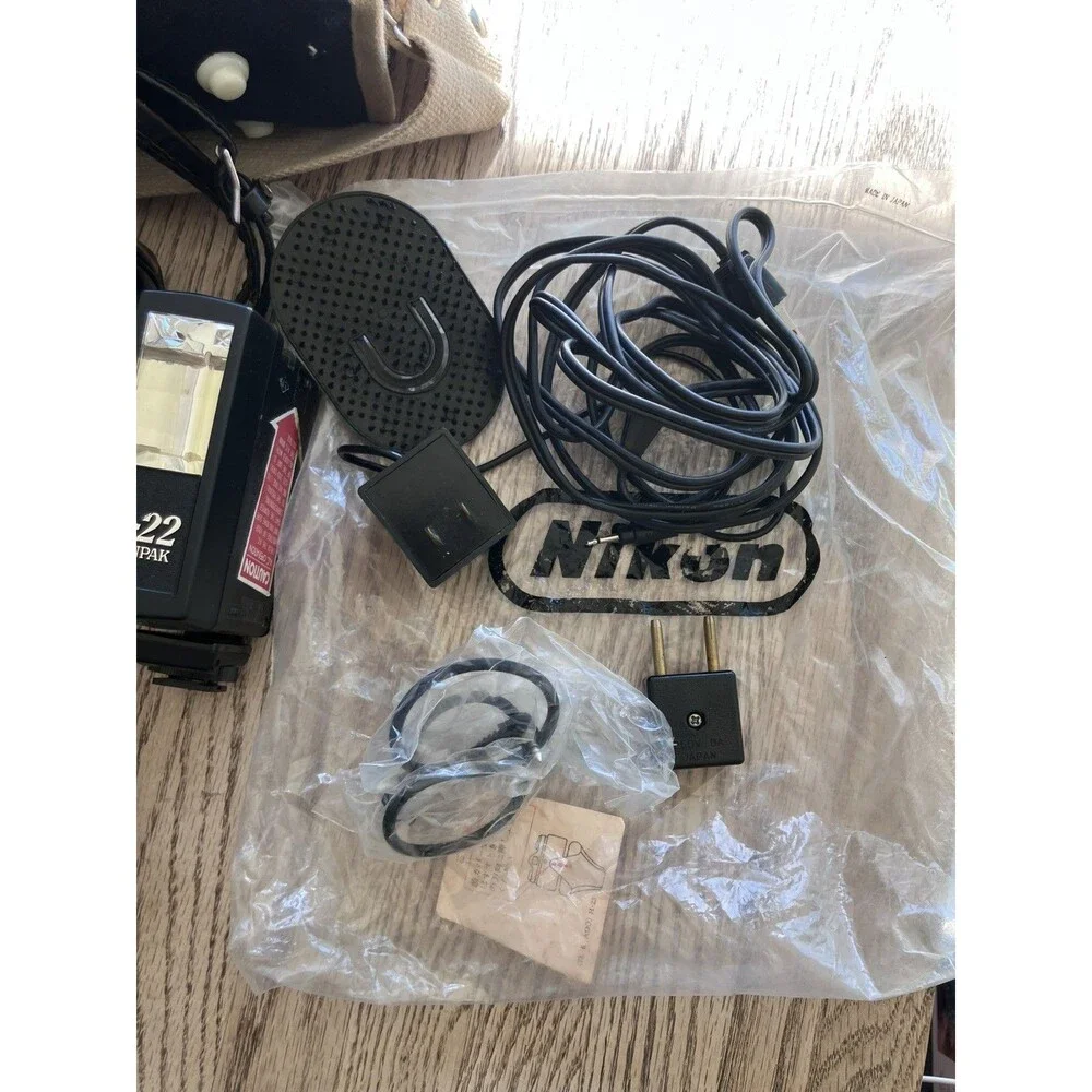 Nikon Nikkormat FTN 35 mm Camera with Additional lens, leather cases, & extras